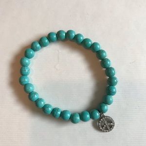 Blue beaded peace sign bracelet